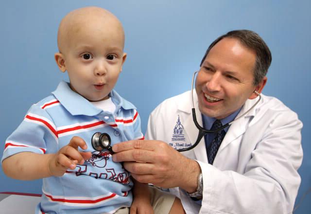 Donald Small, M.D. with pediatric oncology patient